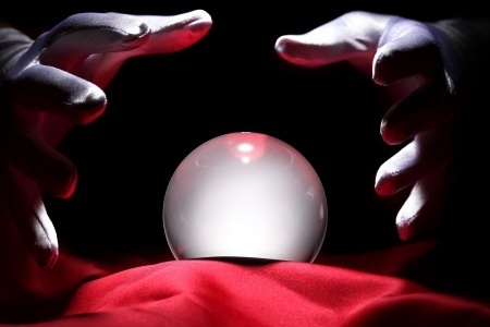 Photo of a mind reader consulting a crystal ball.