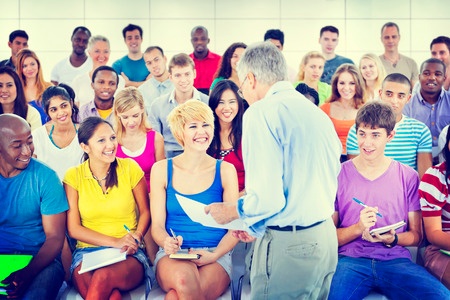 Stock photo of teacher with audience.