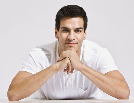 Stock photo of handsome male model leaning forward.