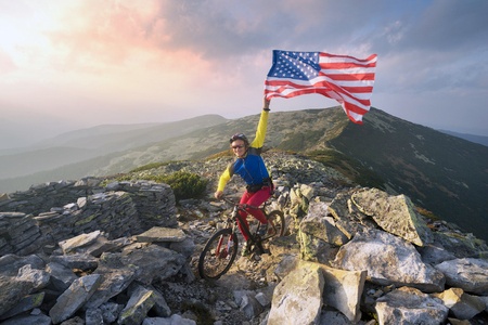 Biker with American flag is a symbol of America First. 