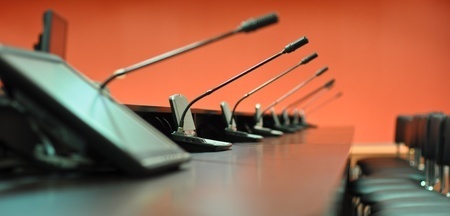 Stock photo of microphones on table.