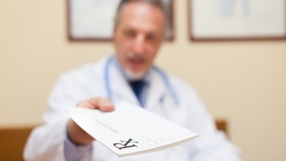 Stock photo of physician giving a prescription to a patient. 