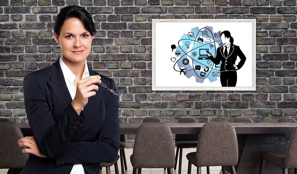 Businesswoman showing PowerPoint slide.