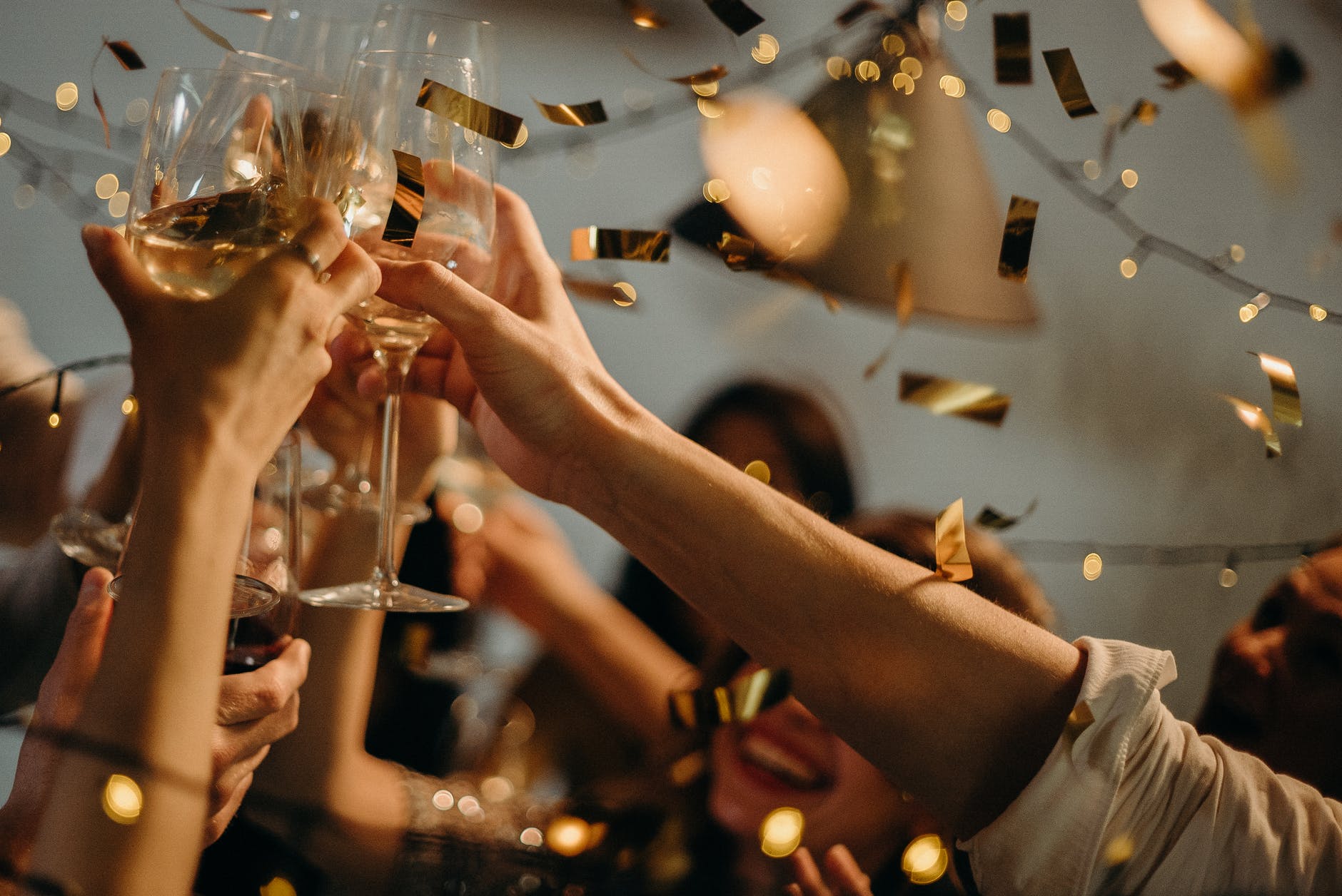 Stock photo showing New Year's Eve celebration with champagne glasses.