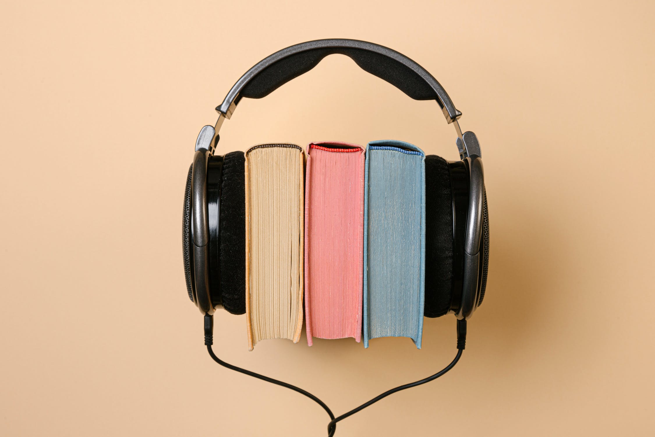 Listening to audiobooks can teach you how to use your voice in business meetings.