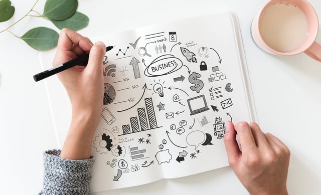 Stock photo of business woman planning a presentation.