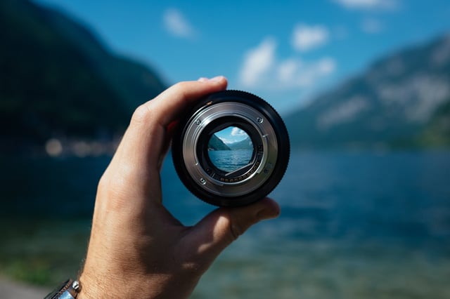 Stock photo of landscape through camera lens.