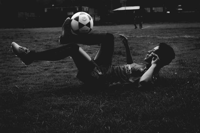 Stock photo of soccer player warming up.