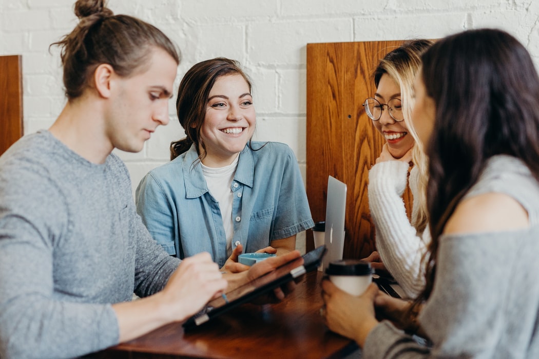 Stock photo of friends chatting. 