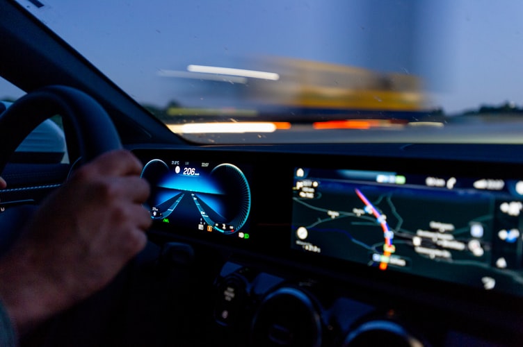 Stock photo of dashboard in car going fast.