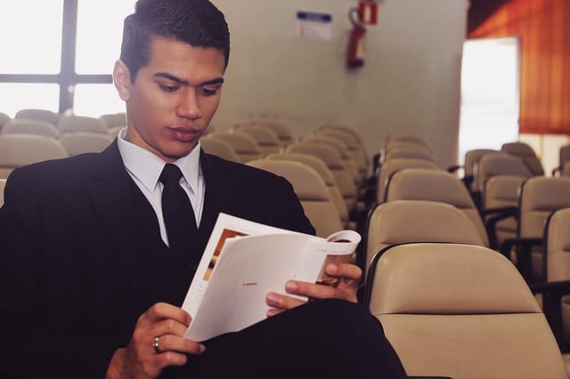 Stock photo of young male Latino public speaker.