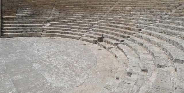 Stock photo of ancient Greek theater or amphitheater with stone steps.