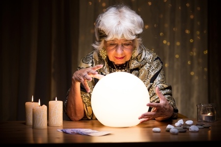 Stock photo of woman with crystal ball, a mindreader.