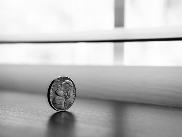 Stock image of coin, heads or tails equals success or failure.